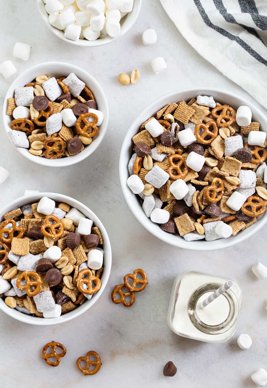 s'mores snack mix in bowls with milk