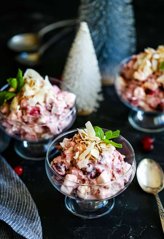 cranberry millionaire salad in glass dishes with Holiday decorations