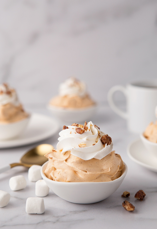 Pumpkin Spice Fluff in white dish with coffee, marshmallows and pecans